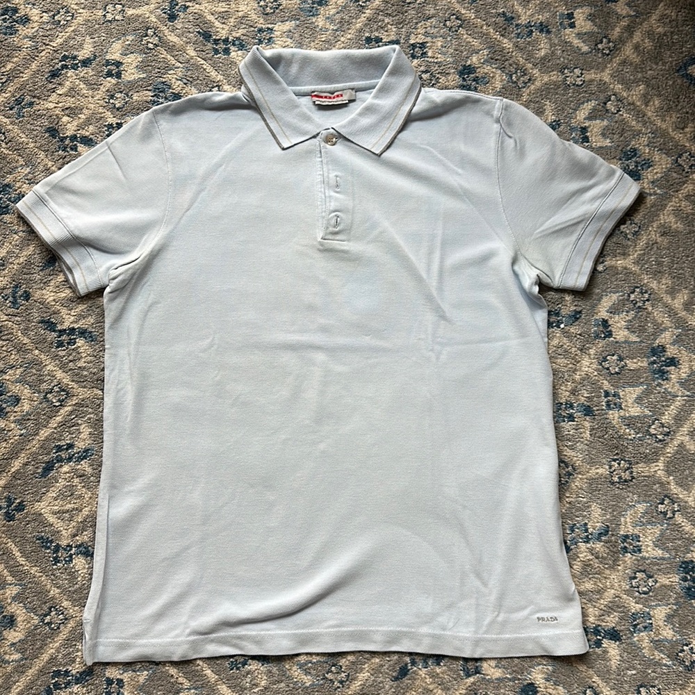 Prada Polo Shirt in Light Blue with Prada Stitched on bottom